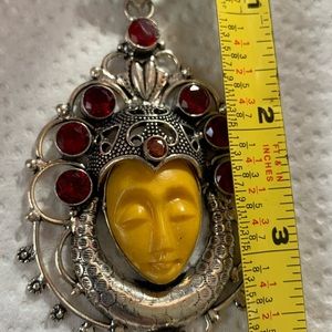 Gorgeous sleeping carved face pendant.
